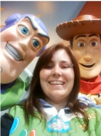 Photo of Claire with life-size Toy Story characters Buzz Lightyear and Woody